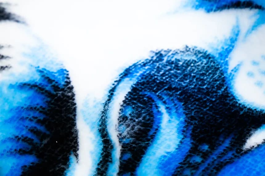 Macro close-up of crisp sublimated print detail and plush pile on NubaySoft fabric