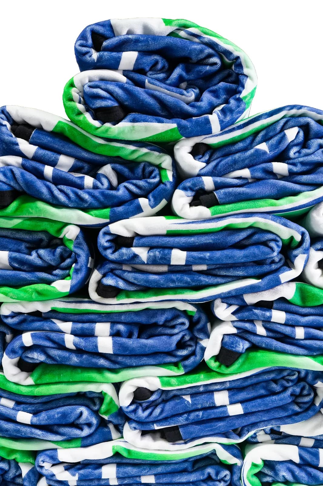 A neatly folded stack of NubaySoft blankets, one program packed and ready to ship